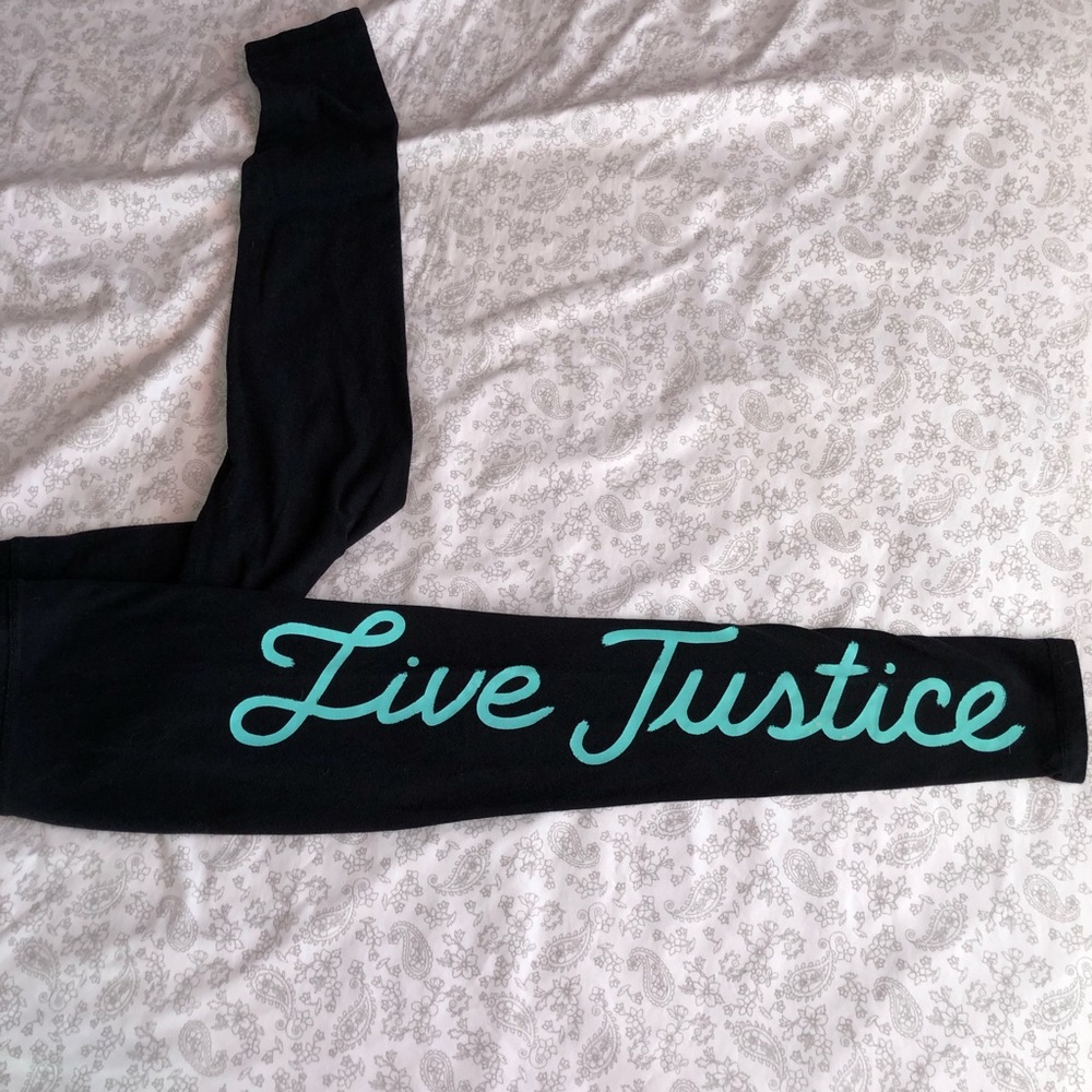 Justice black leggings with teal writing size.12